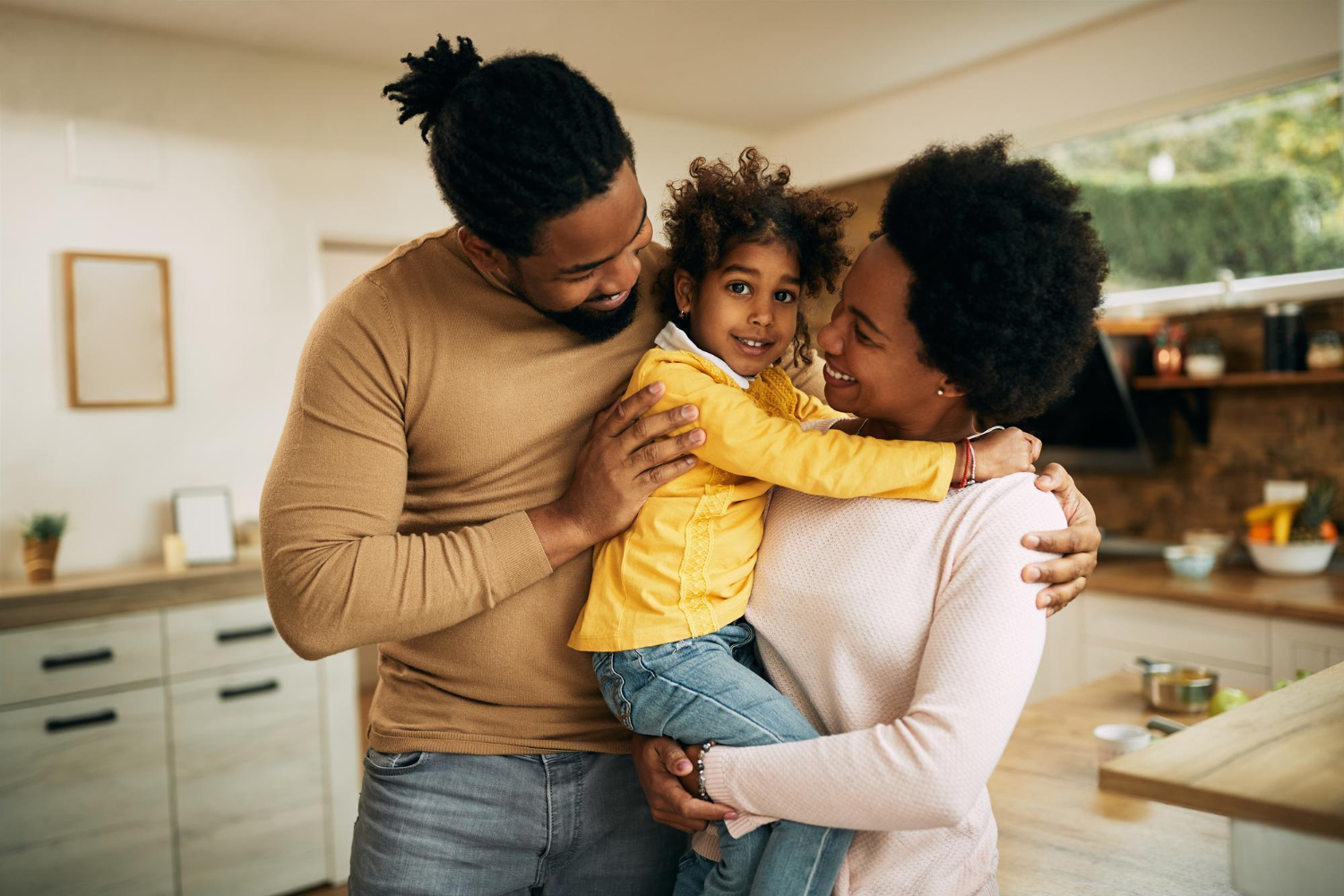 Happy Black Parents with Daughter